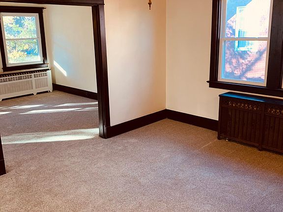 Combined view of the dining room, from the hallway, looking into the living room