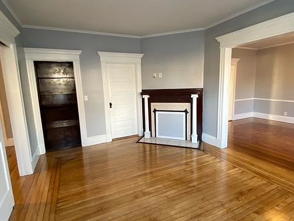 Living room with built in bookcase and fireplace (non-active).