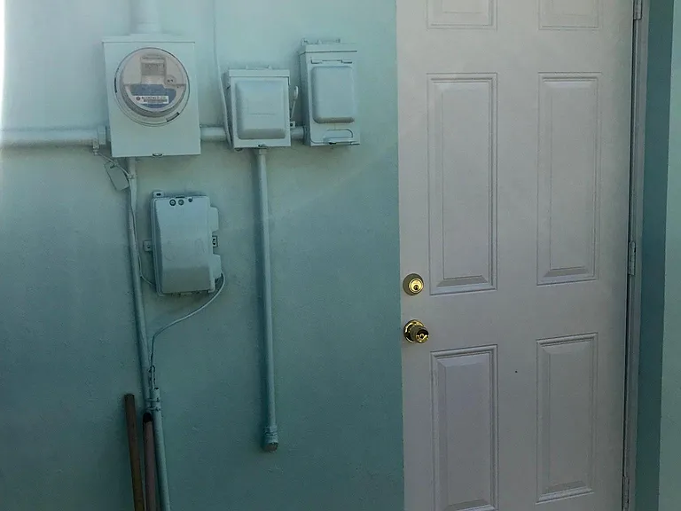Back door leading from untility room .