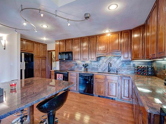Large kitchen with 42" cabinetry and slab granite.