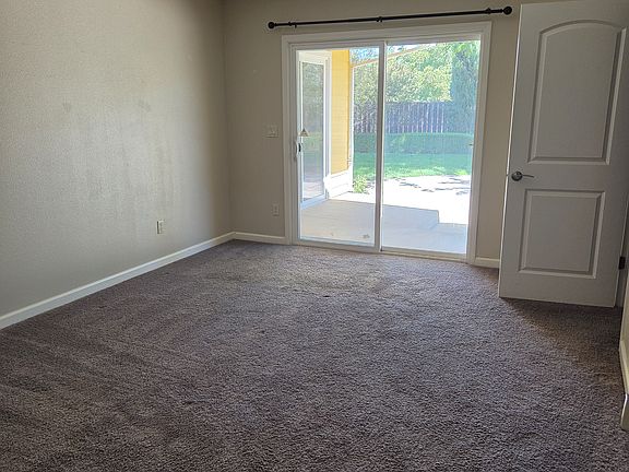 Primary bedroom opens to back yard. There are 4 bedrooms, each has a walk-in closet.