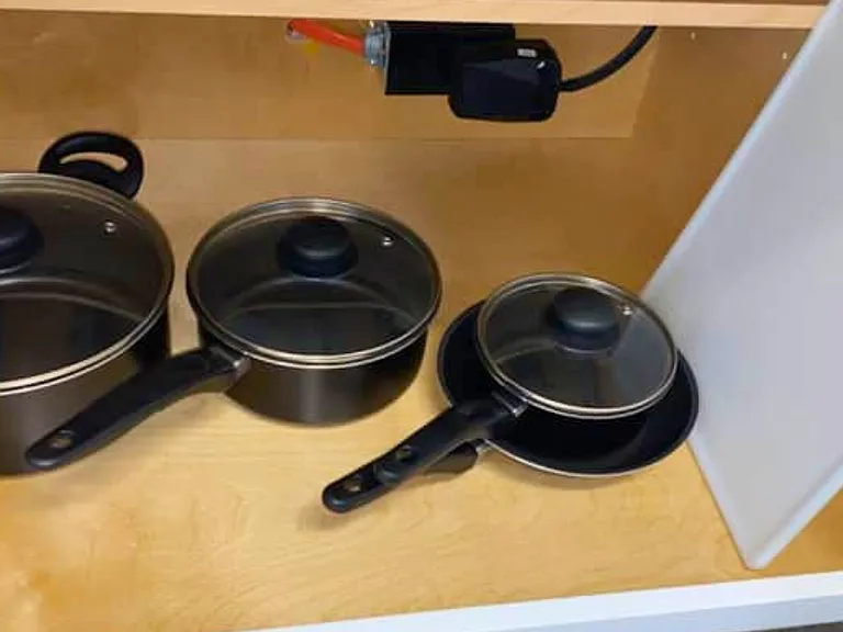 Everything you need, including pots, lids, and a cutting board.