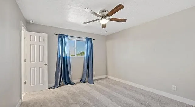 Draperies removed and custom blinds in place.