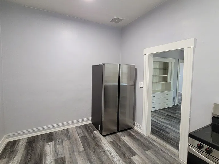 Full size fridge and dining area