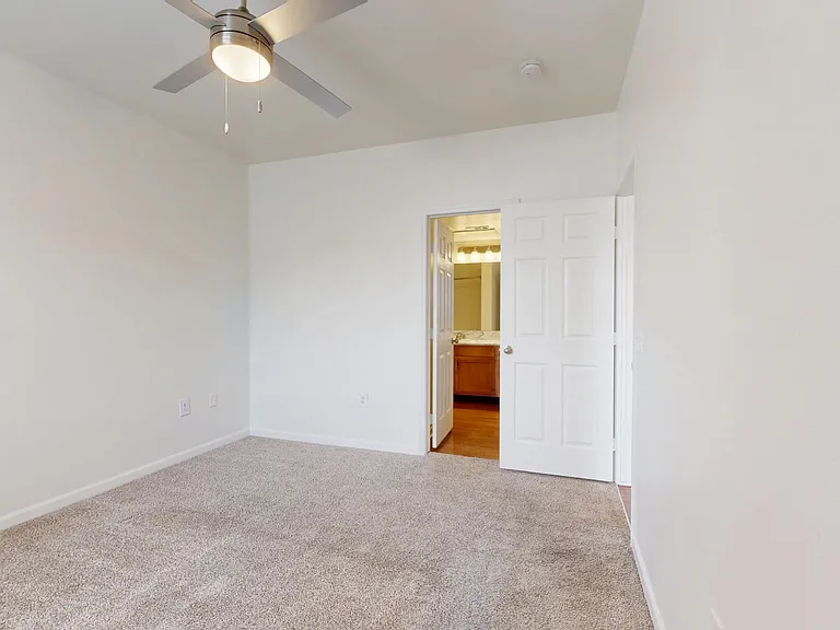 Spacious apartment Bedroom with Carpet Floor.