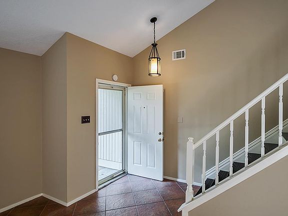 Welcoming entry with vaulted ceilings.