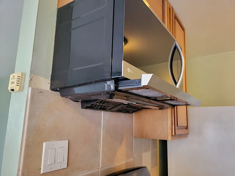 Showing how the vent comes out over the stove