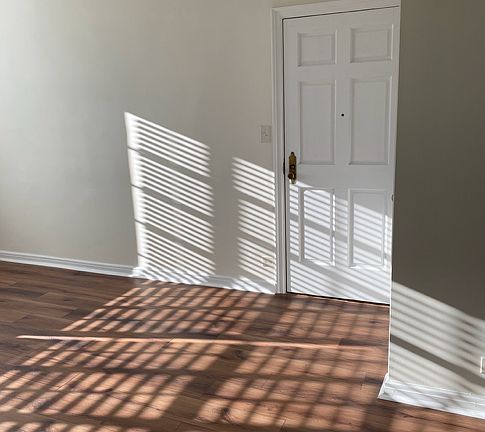 In living room, facing door to hallway.