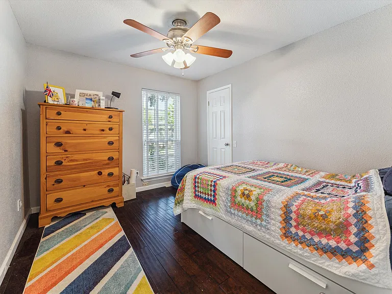 Cozy third bedroom with a walk-in closet