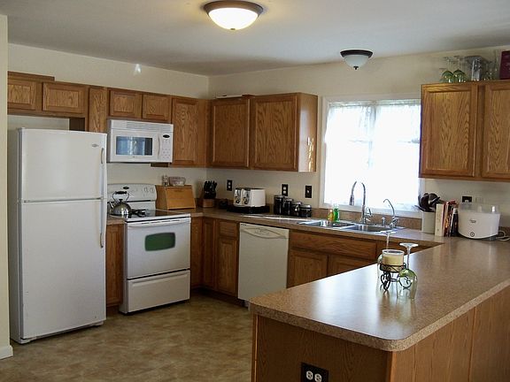 Kitchen is spacious & has extended counters