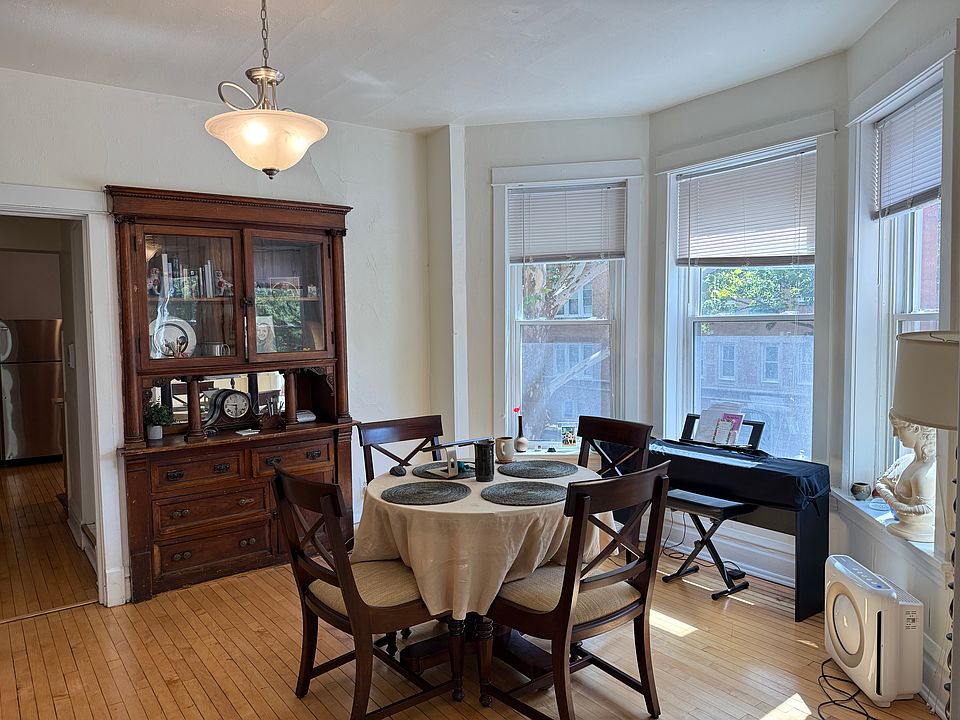 dining room w/ bay windows and beautiful built-in