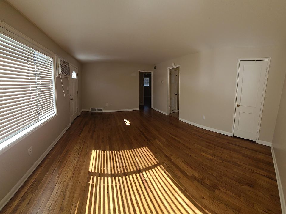 Beautiful living room w closet, looking towards kitchen and hall with a linen closet then leads to bedrooms and a new full bath!