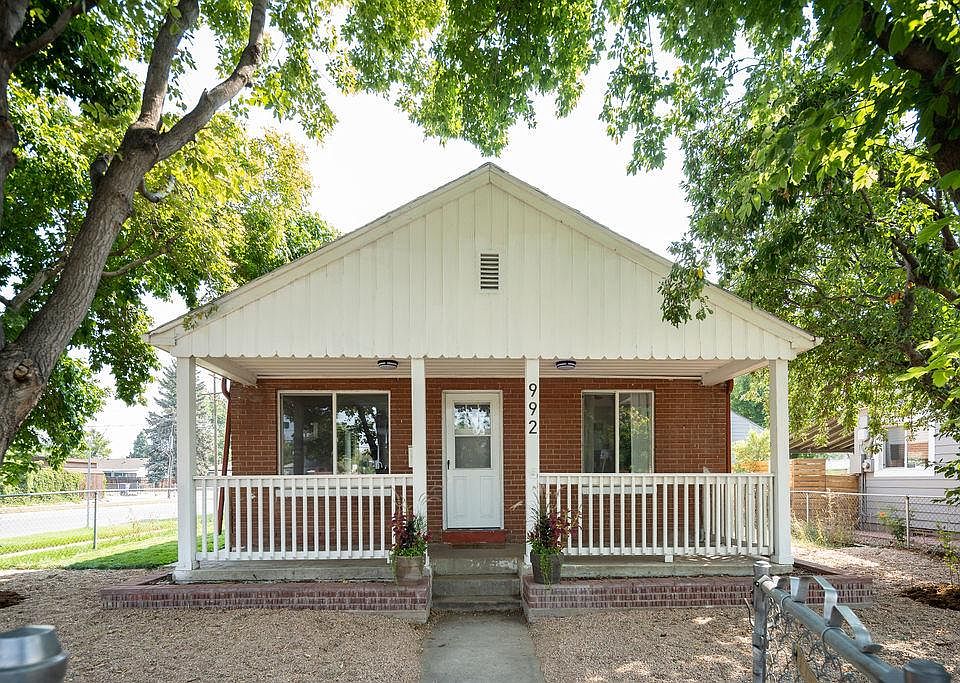 Front of the house with fenced in yard.
