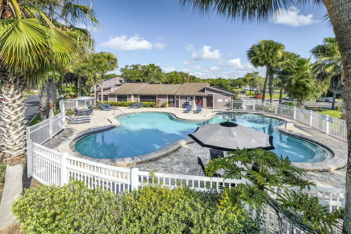 Resort-style pool, nestled among the palms.