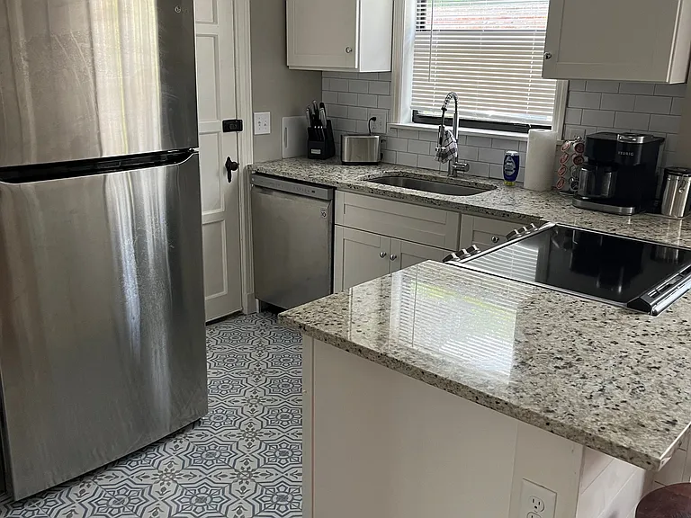 Well appointed kitchen, open to dining, modern appliances