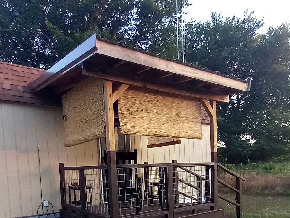 Gated porch w/fairy lights, and horizontal bamboo blinds to keep you cool and for some privacy.