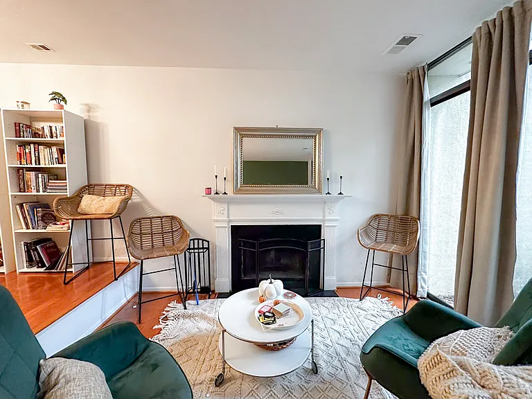 Conversation area in sunken living room with working fireplace. Large balcony overlooking woods through the sliding glass doors :)