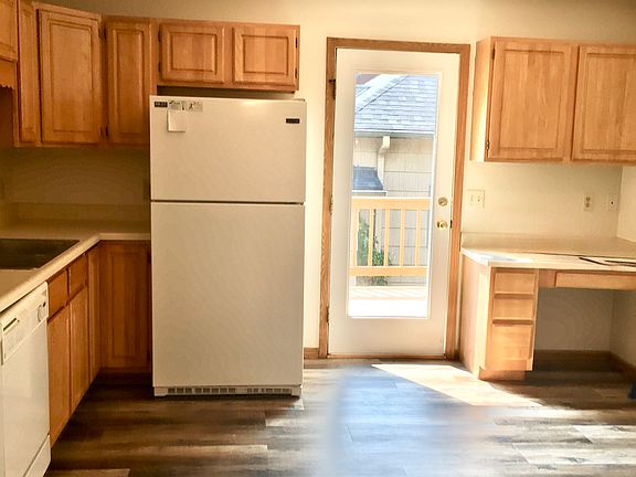 large eat in kitchen with outside balcony.