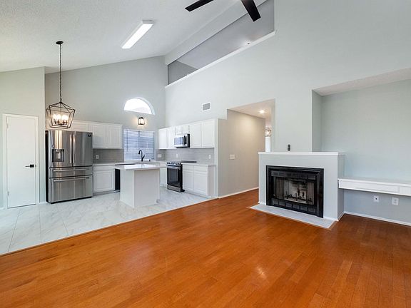 family room with fireplace opens to the kitchen and breakfast area