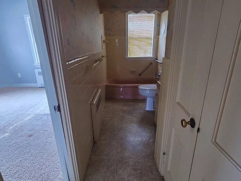 Generous closet space paired with a spotless bathroom.