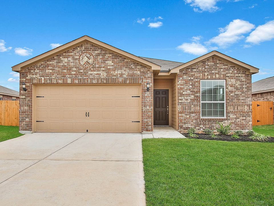 This single story home has a brick exterior and front yard landscaping