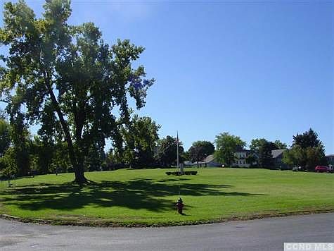 Taken from the open corner of the property, this is a stunning view of the memorial monument in Wortman Square - a perfect place to sit on a park bench and take in the day.