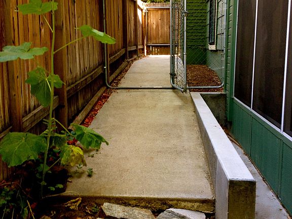 Side of House With Kennel