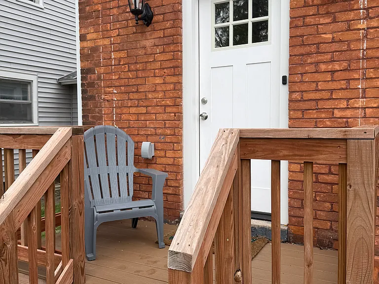 Entrance is on the back of the building with a small private deck.
