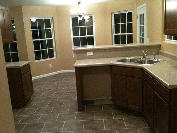 Kitchen has large pantry and gorgeous maple cabinets