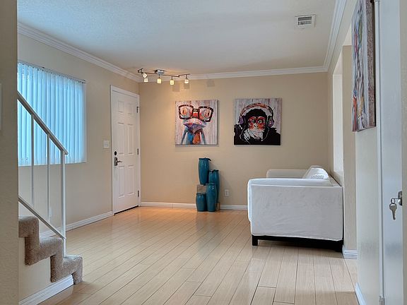 Living room with extra space by the stairs