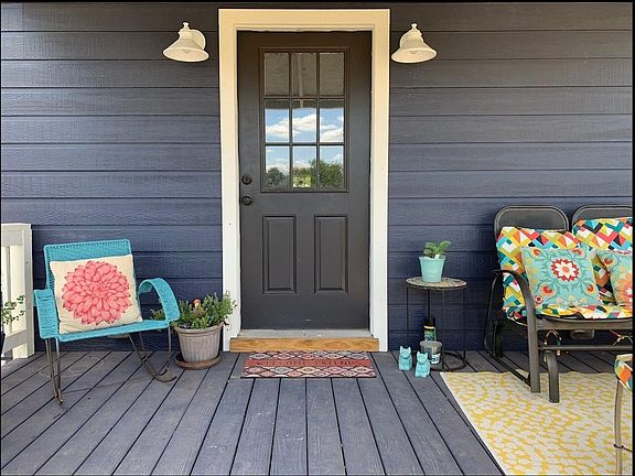 Welcoming front entry with sitting area facing west.