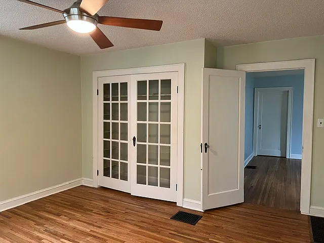 Main bedroom with glass doors on closet