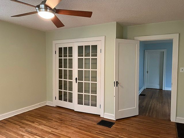 Main bedroom with glass doors on closet