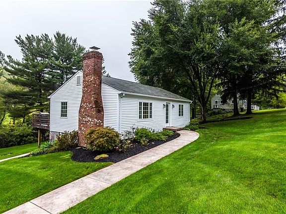Beautiful landscaping and stamped concrete sidewalk.