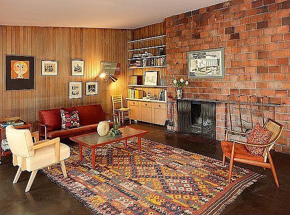 Liv rm. Recycled brick from downtown Seattle building. Large fireplace. Pigmented composite floors.