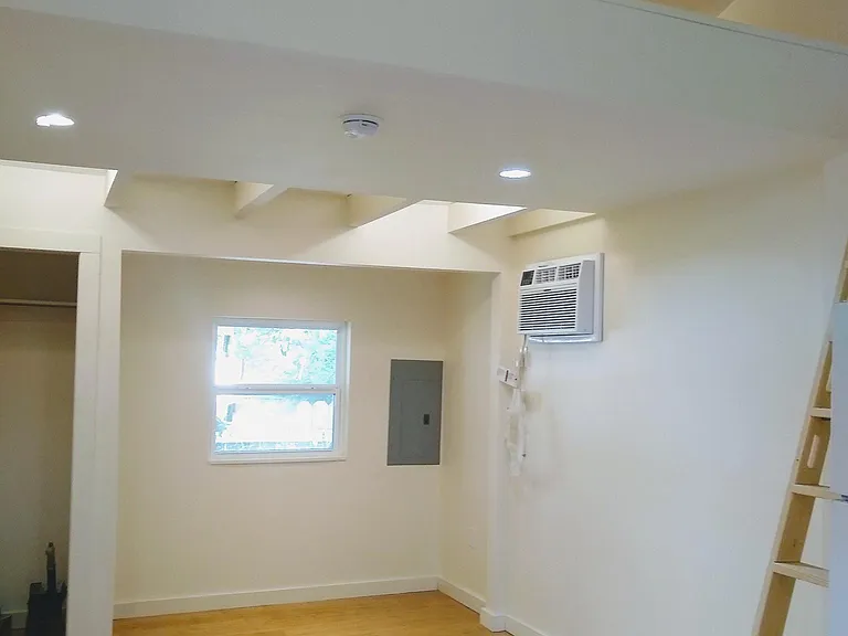 Bed nook (fits a queen-sized bed). Living area with closet. Loft above.