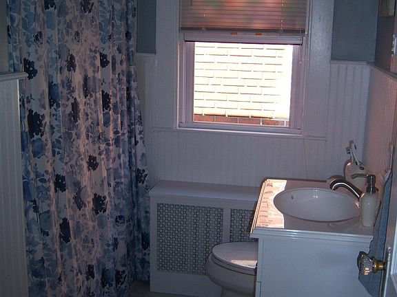 Bright bathroom with beadboard and subway tile