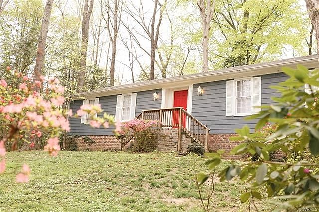 Ranch home tucked on a serene, wooded lot.