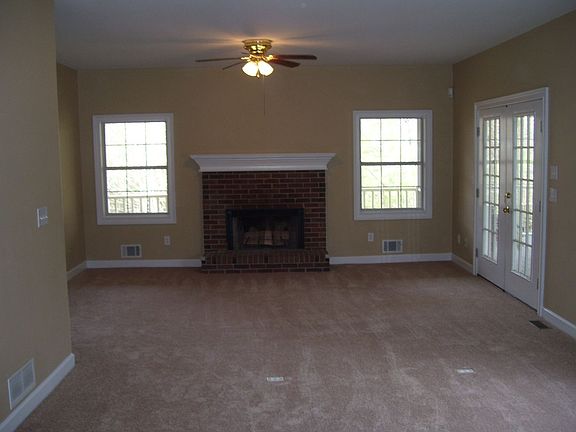 Living area with fireplace and french doors to deck