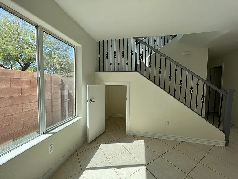 The dining area has a small storage closet under the stairs.