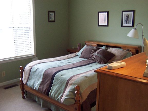 Bedroom 1 with Large Window and Vaulted Ceiling