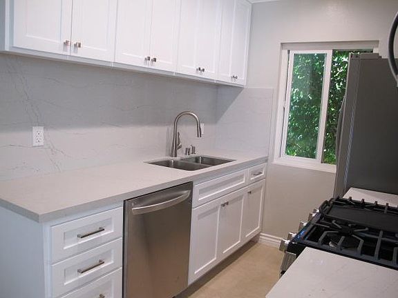 Kitchen with all new cabinets, counters, back splash, and LG stainless appliances.