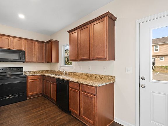 The Thomas has designer wood cabinetry and granite countertops.