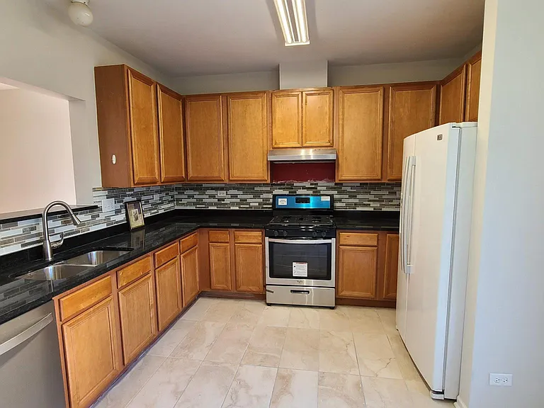 Spacious Kitchen - with new Granite countertops, Gas Range, Hood and dishwasher