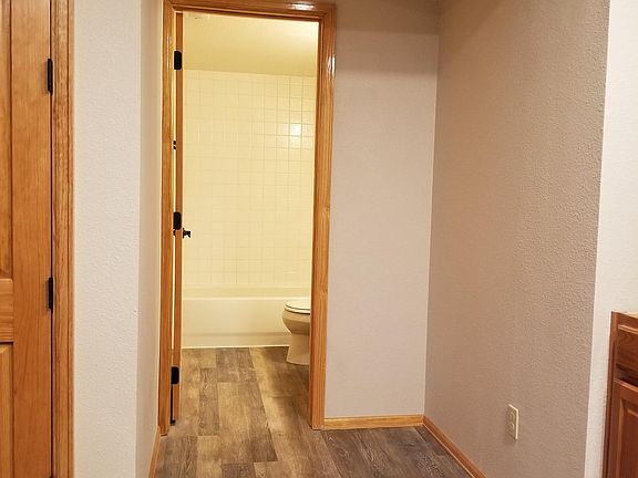 Bathroom with apartment entance on left