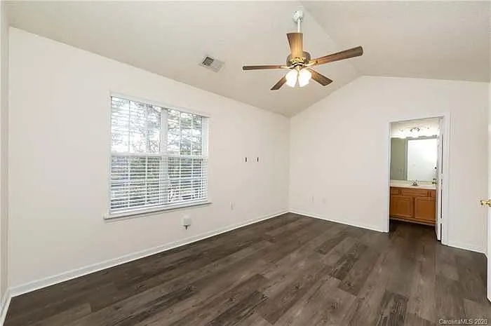 Spacious Second Bedroom. Using Queen bed, Work table, Couple of chests and even them ample space is left.