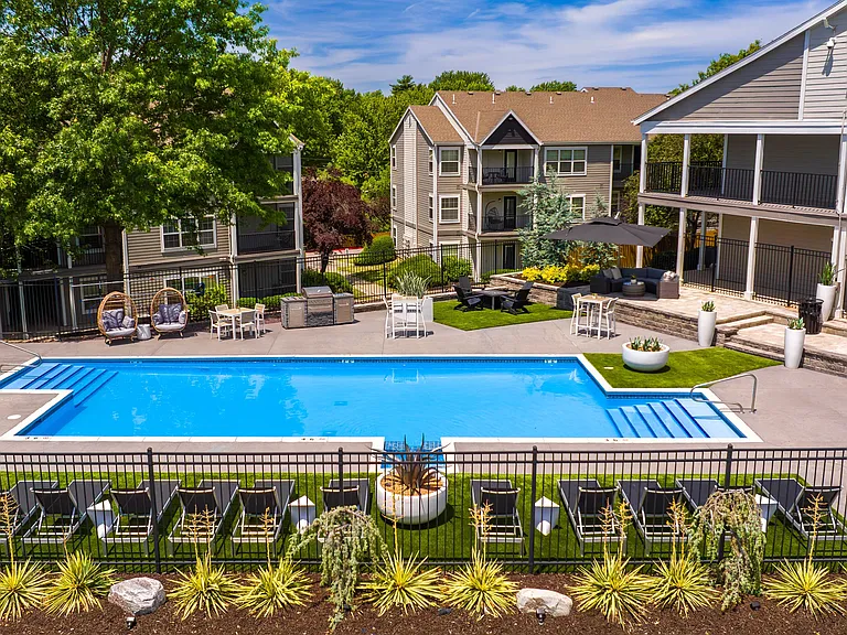 Relax and unwind at our inviting poolside retreat, featuring comfortable lounge chairs, cozy seating areas, and beautifully landscaped surroundings for the perfect summer day.