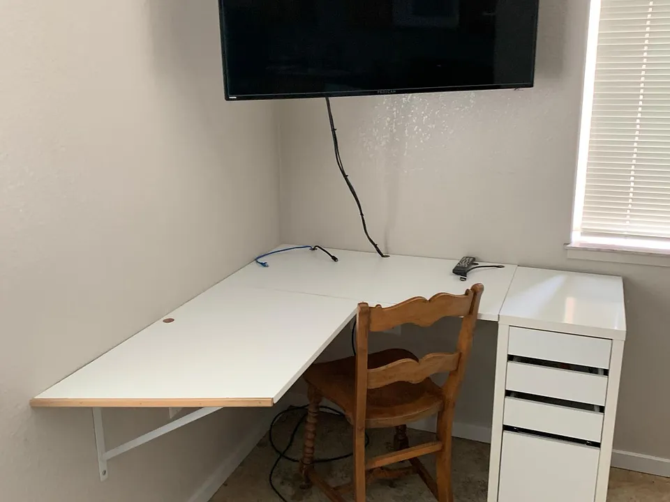 Desk area with an area to mount a TV. (TV not included)