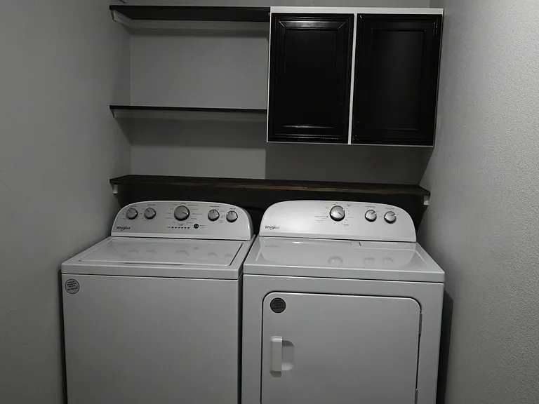 The laundry room off the side of the living room.