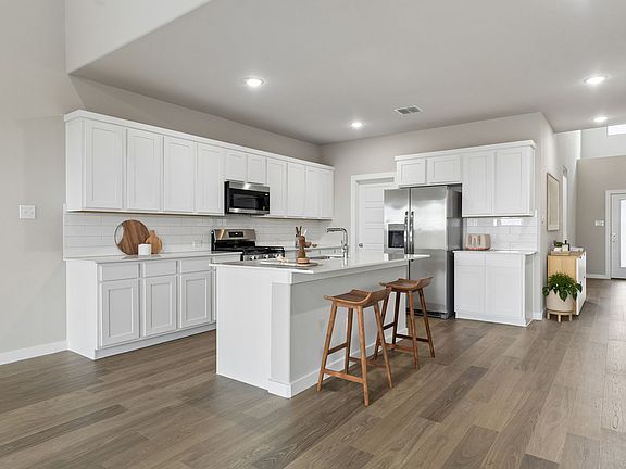 Kitchen in the Winters home plan by Trophy Signature Homes - REPRESENTATIVE PHOTO